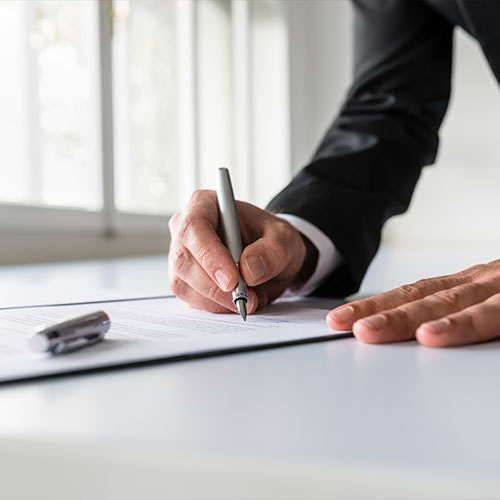 businessman in office signing contract