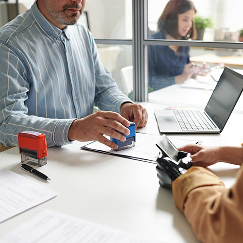 Manager of visa center having meeting with client