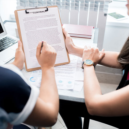 Business People Discussing Contract Closeup
