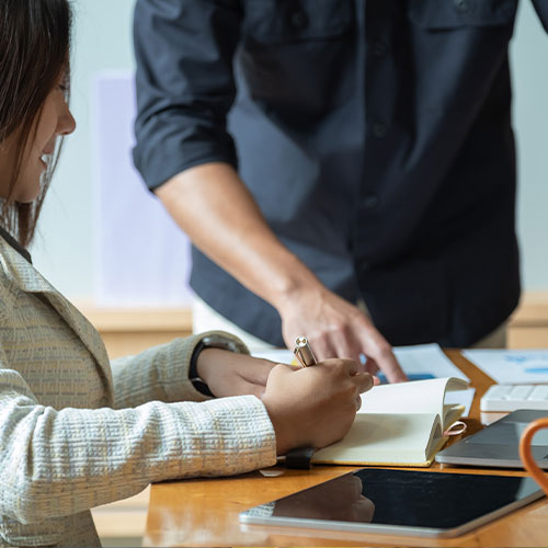 Asian business adviser meeting to analyze and discuss the situation on the financial report