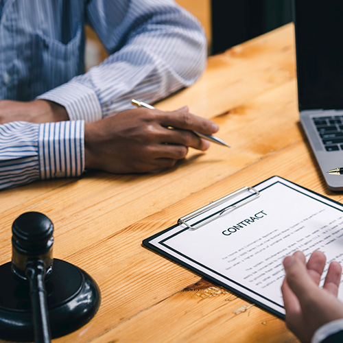 Male Notary lawyer or judge consult or discussing contract papers with Businessman client in the office, Consultation between a male lawyer and businessman concept. Sign a contract